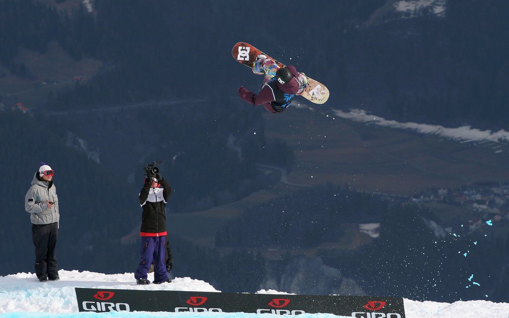 Snowboarder doing flippy-spinny things