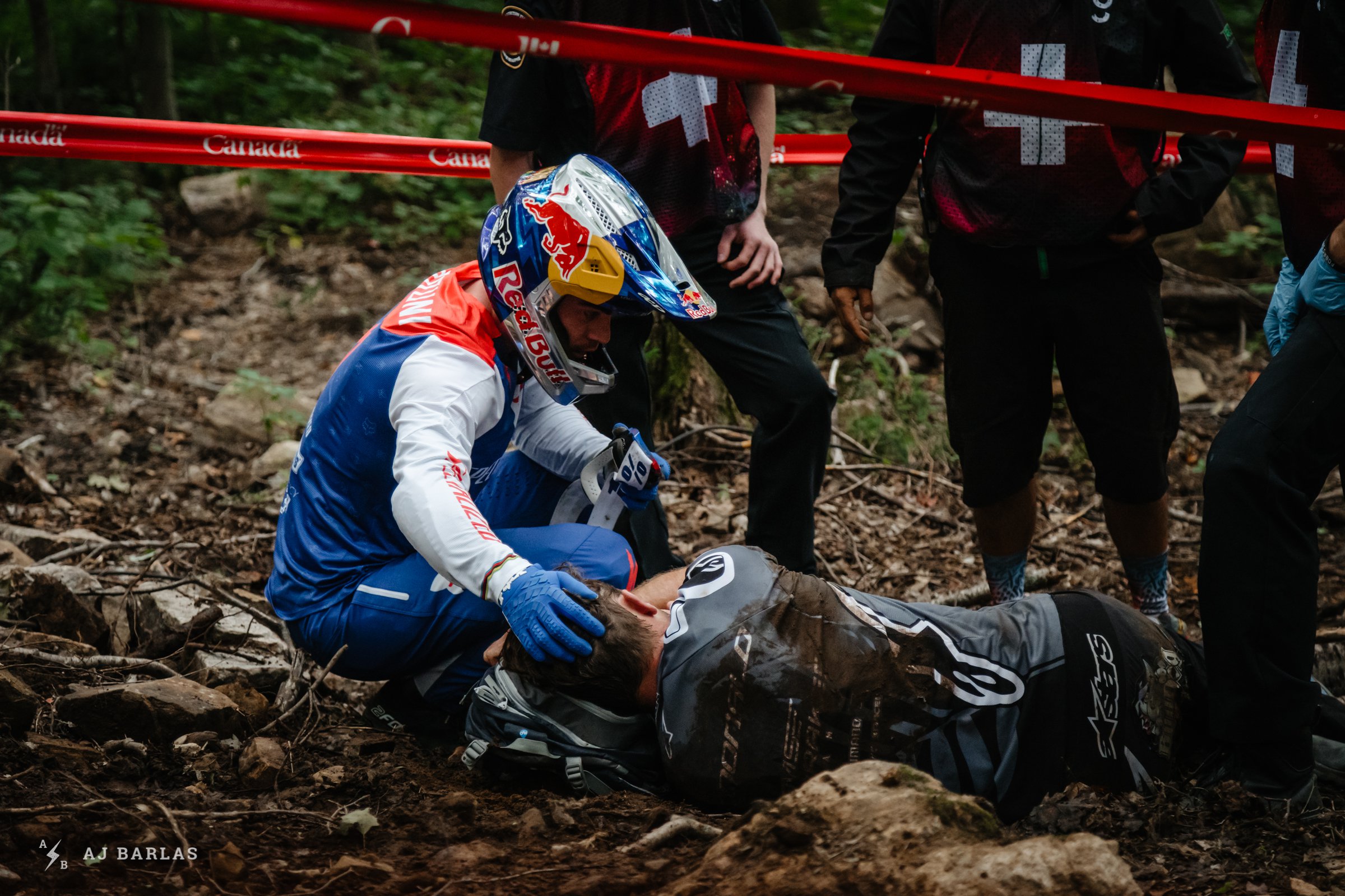 Loic Bruni comforting an injured Brook MacDonald